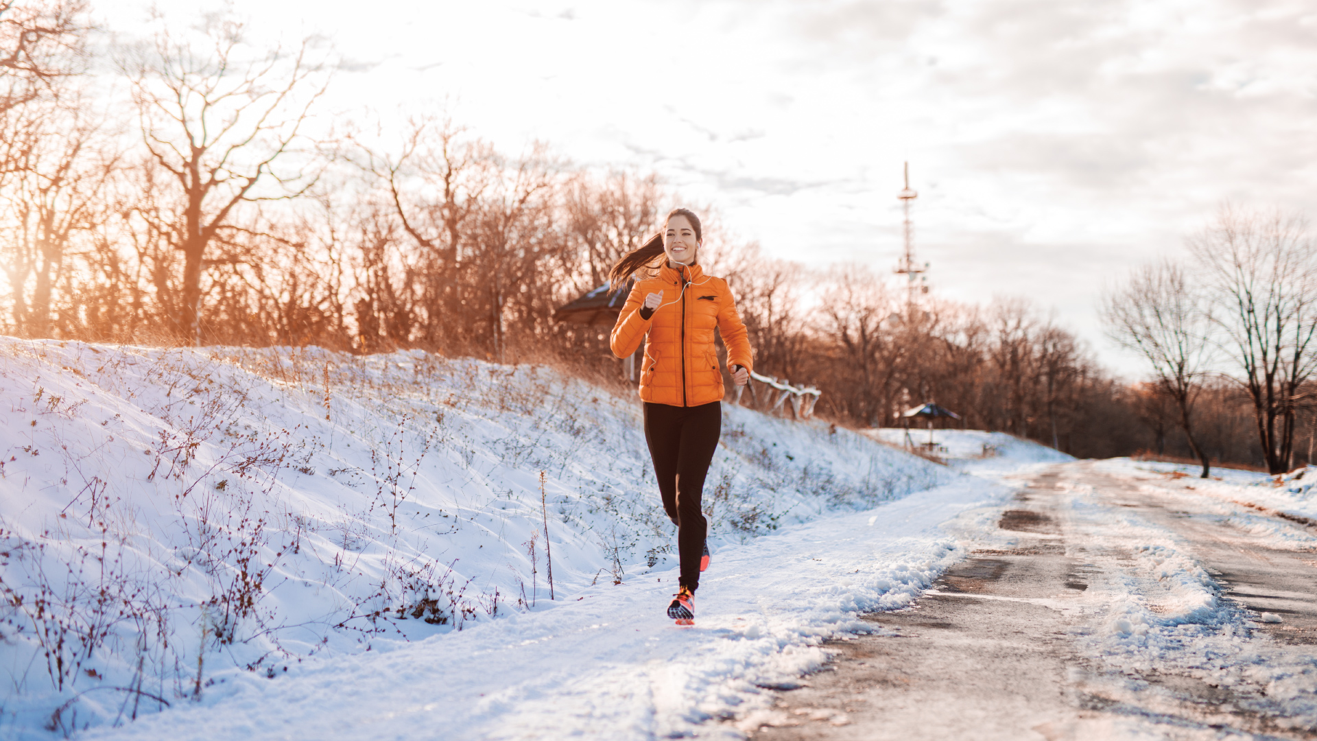 A person running in a trail during winter