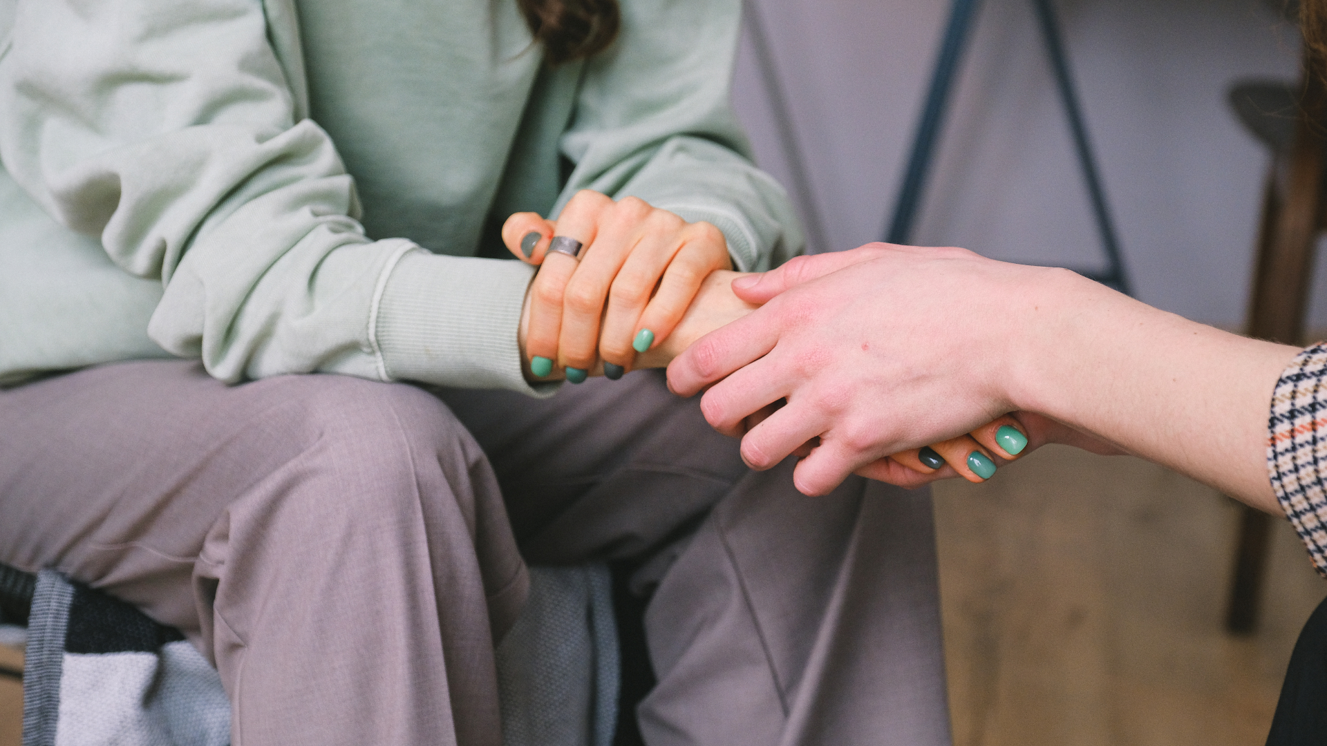 Two people holding hands