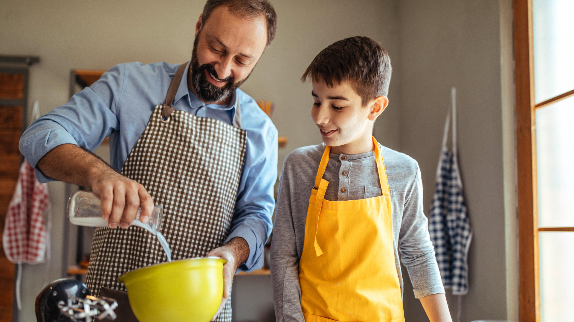 Foster parent making a dish with a